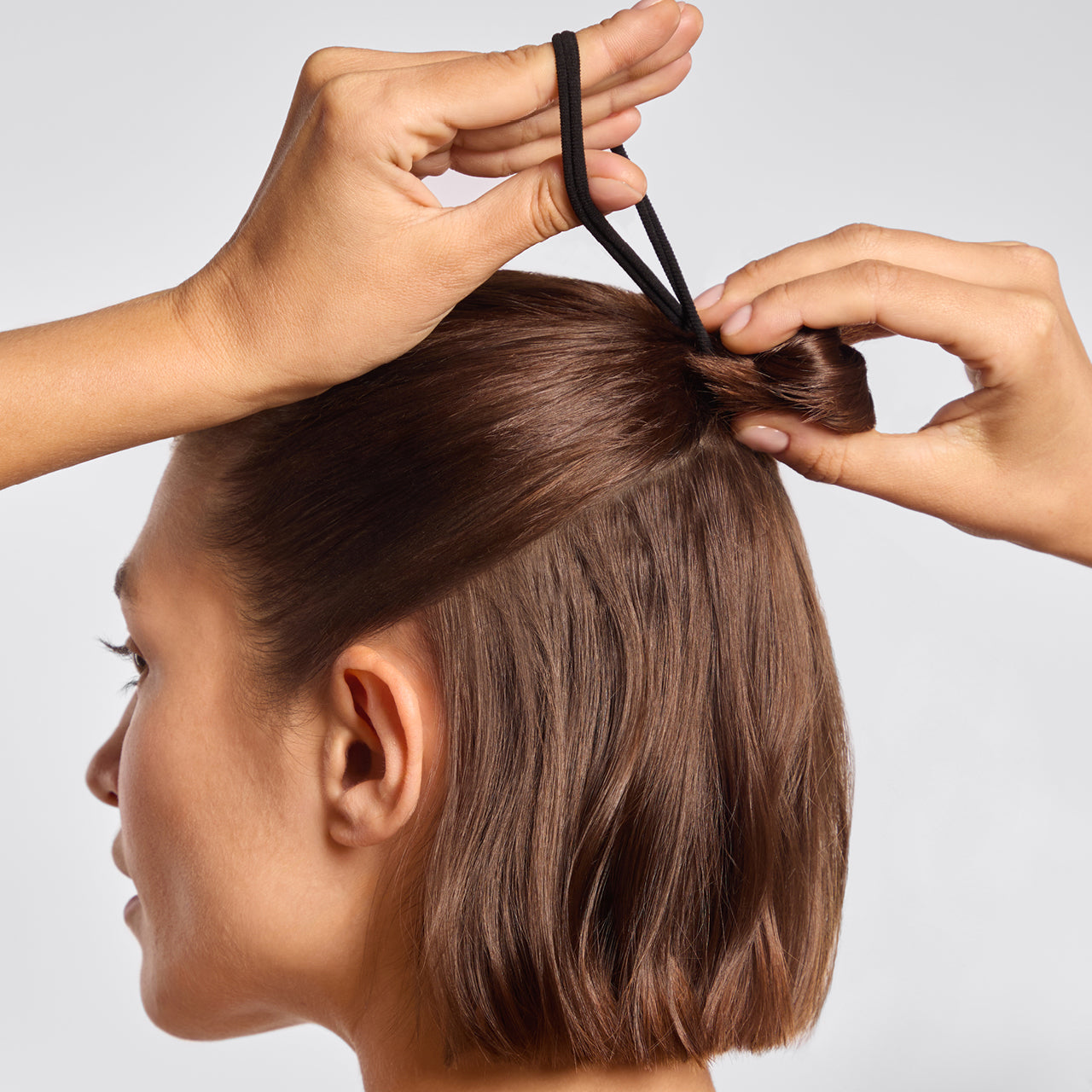 68899-SeamlessHairElastics-8pc-Hair-Black-Model-1280x1280px-1.jpg